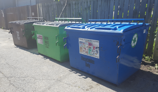 St. Louis dumpsters. Brown is for trash, green is for yard waste, blue is for recycling.