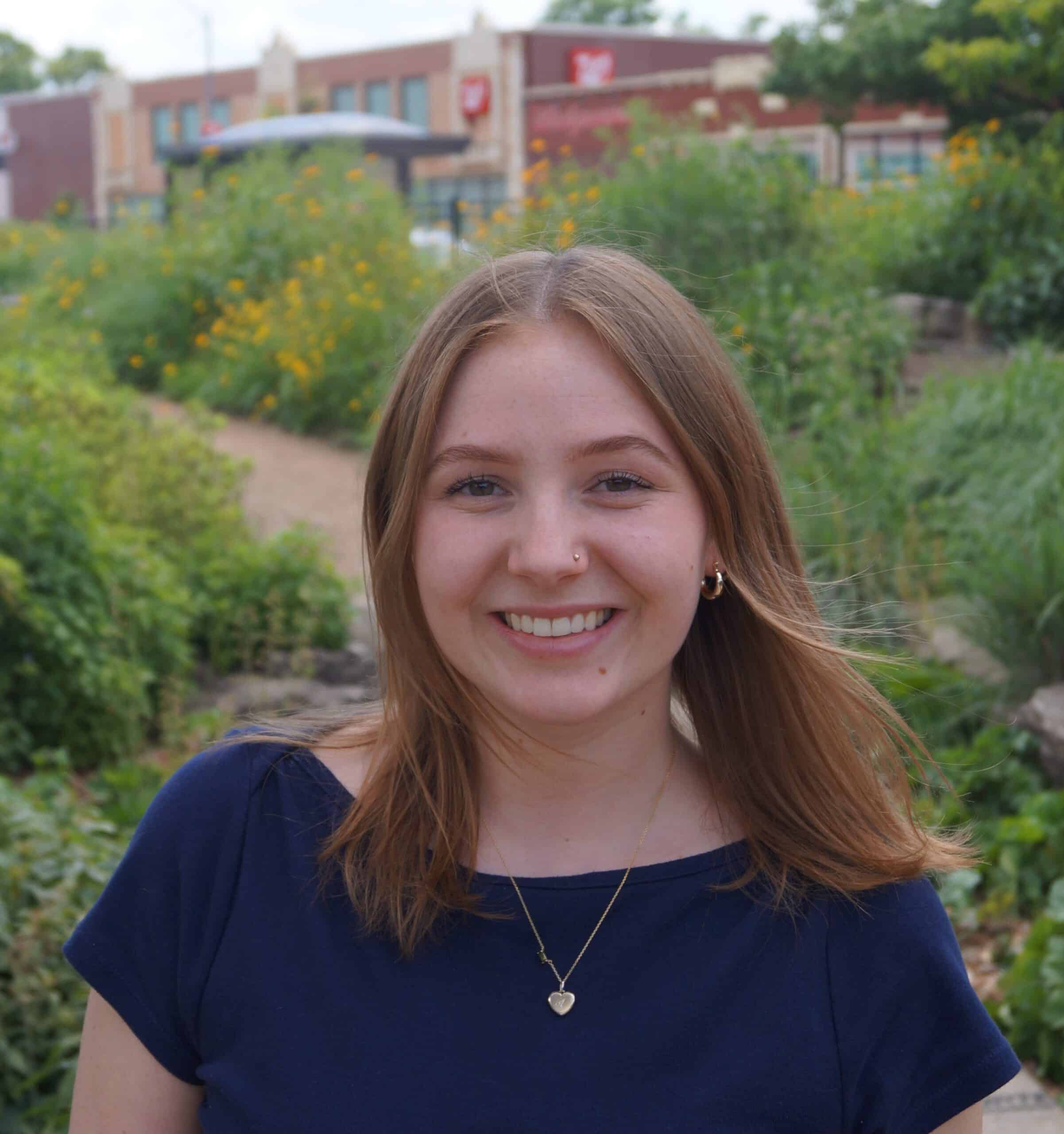 Ava Hohn standing in the Brightside Demonstration Garden